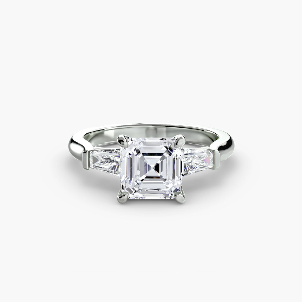 Anello trilogy con baguette laterali — montatura